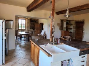 a kitchen with a sink and a counter top at maison in Montesquiou