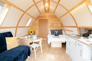 a tiny house with a kitchen and a bedroom at Eden Valley by Wigwam Holidays in Cumwhinton
