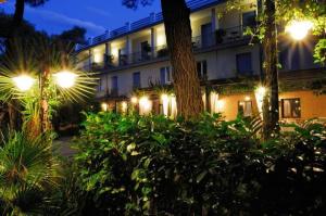 a building with street lights in front of it at Hotel Villa Giusy in Castellaneta Marina