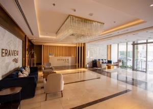 a lobby with a couch and chairs in a building at VIP Luxury Premium Apartment in Manama +89 photos