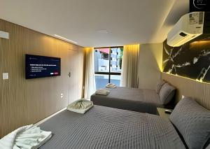 Cama ou camas em um quarto em LM Unity Cabo branco