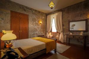 Uma cama ou camas num quarto em Quinta do Terreiro - Turismo de Habitacao