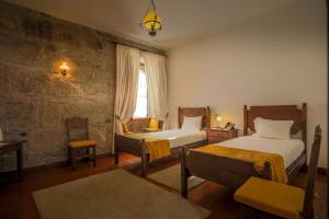 Uma cama ou camas num quarto em Quinta do Terreiro - Turismo de Habitacao