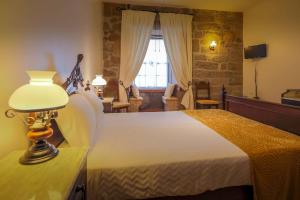 Uma cama ou camas num quarto em Quinta do Terreiro - Turismo de Habitacao