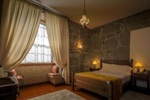 Uma cama ou camas num quarto em Quinta do Terreiro - Turismo de Habitacao