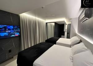 Ein Bett oder Betten in einem Zimmer der Unterkunft LM Get One