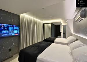 Ein Bett oder Betten in einem Zimmer der Unterkunft LM Get One