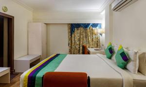 Postel nebo postele na pokoji v ubytování Hotel Crown