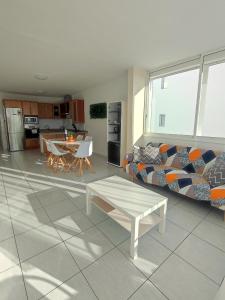 a living room with a couch and a table at 16 Sunset view in Adeje