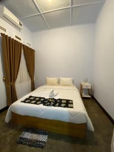 Postel nebo postele na pokoji v ubytování Ijen & Sleep Homestay