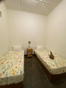 Postel nebo postele na pokoji v ubytování Ijen & Sleep Homestay
