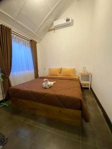 Postel nebo postele na pokoji v ubytování Ijen & Sleep Homestay
