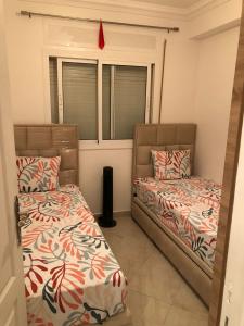 Postel nebo postele na pokoji v ubytování Appartement Rochd Val FLeuri