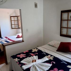 Postel nebo postele na pokoji v ubytování Villa dos Pássaros Paraty Hospedagem