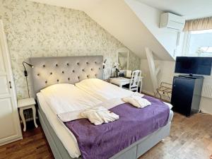 Postel nebo postele na pokoji v ubytování Hotel Concordia