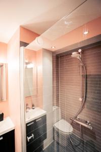 a bathroom with a shower and a sink at Spacious Green Apartment With Amazing Loft in Copenhagen +55 photos