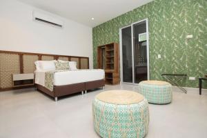 Postel nebo postele na pokoji v ubytování Hotel Boutique Palma Arena