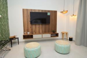TV a/nebo společenská místnost v ubytování Hotel Boutique Palma Arena