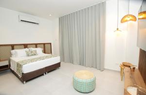 Postel nebo postele na pokoji v ubytování Hotel Boutique Palma Arena