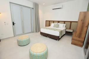 Postel nebo postele na pokoji v ubytování Hotel Boutique Palma Arena