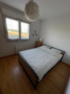 Una cama o camas en una habitación de Logement Wie dheim