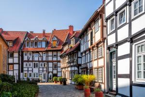 a row of half timbered houses in a street at STAYERY Gütersloh Hauptbahnhof & City Center - alle Zimmer mit Klimaanlage in Gütersloh