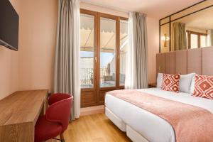 Ein Bett oder Betten in einem Zimmer der Unterkunft Room Mate Leo, Granada