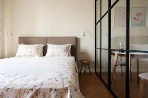 Ένα ή περισσότερα κρεβάτια σε δωμάτιο στο Cozy Nest in Premium Residence +27 φωτογραφίες