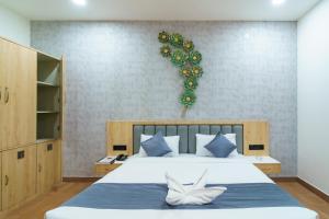 Voodi või voodid majutusasutuse Satyabhama Inn toas