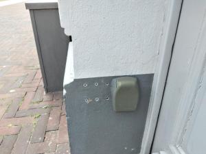 a door with a box on the side of a building at Singelachterhuis Roermond in Roermond
