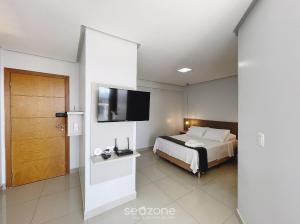 Ένα ή περισσότερα κρεβάτια σε δωμάτιο στο Onix Bueno Residence - ONX