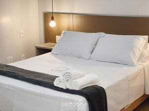 Ένα ή περισσότερα κρεβάτια σε δωμάτιο στο Onix Bueno Residence - ONX