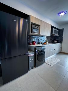 Kuchyň nebo kuchyňský kout v ubytování Luxury Condo at Viva Jaco Residence
