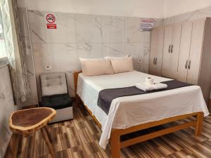 Ένα ή περισσότερα κρεβάτια σε δωμάτιο στο Libélula Hotel