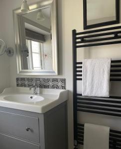 a bathroom with a sink and a mirror at Bernstorfshof in Jübek +36 photos