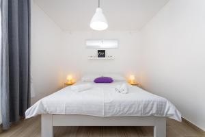 Posteľ alebo postele v izbe v ubytovaní Villa La Pieda