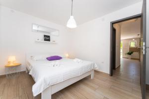 Posteľ alebo postele v izbe v ubytovaní Villa La Pieda