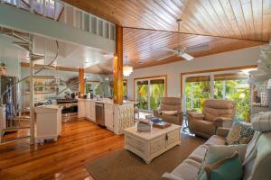 a kitchen and living room with a couch and a table at Blackbeard`s Hideaway in Key West