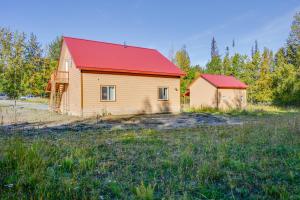 a barn with a red roof in a field at Soldotna Vacation Rental Near Fishing and Hiking! in Soldotna