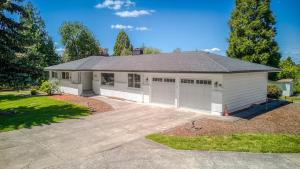 a house with a garage with a driveway at Vogel Vacation - Spacious Secluded, Hot Tub & Game Room in Damascus