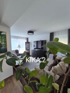 a living room with a couch and a table at Kika apartmani-FREE PARKING- 7 km od centra in Zagreb +31 photos