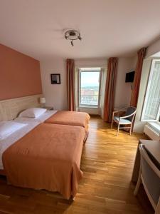 Postel nebo postele na pokoji v ubytování Auberge Aux Deux Sapins