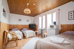 Postel nebo postele na pokoji v ubytování Arctic Guesthouse & Igloos