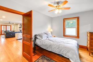 a bedroom with a bed and a ceiling fan at Charming Damascus Retreat with Deck and Creek Views! in Damascus