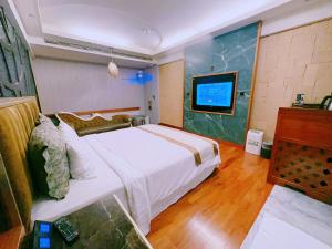 Postel nebo postele na pokoji v ubytování Mucha Motel