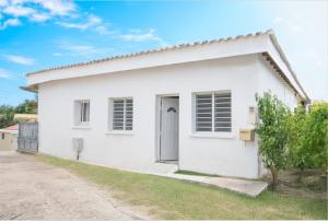 a white house with a driveway at Bethanie in Le Gosier +15 photos