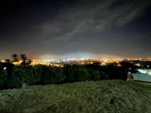a view of a city at night with lights at Voá Flat in Capivari