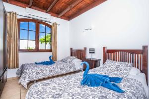 Postel nebo postele na pokoji v ubytování Villa Emilia + 13 fotografií