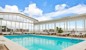 a pool on the roof of a hotel at Vintage Hotel Mercedes in Lloret de Mar