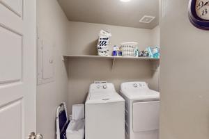 a small laundry room with a washer and dryer at Great Escape in Washington